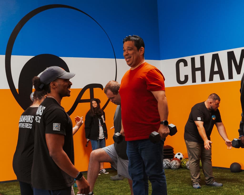 Trainer and client training with dumbbells